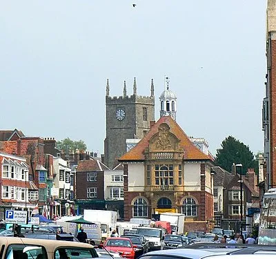 A view along Marlborough High Street Looking north-east. The Town Hall is just to the right of centre with the tower of St Mary's church behind it. Market day (Saturday).