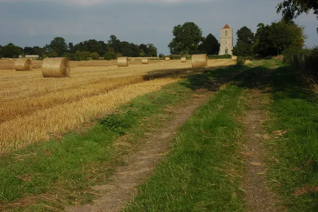 Baled straw and Pendock Church Old Pendock church is in an isolated position adjacent to the site of the long gone medieval village. Access to the church is along this track beside this field of straw which was being baled at the time the picture was taken.
