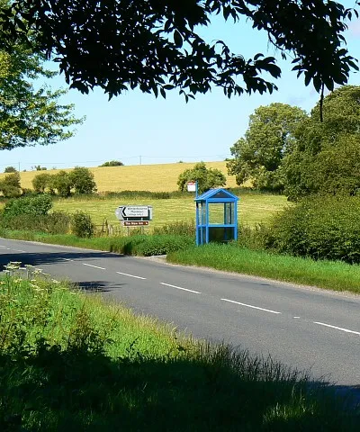 Bus stop, Winterbourne Monkton The blue bus stop is about 11 metres from the northern gridline of the square.