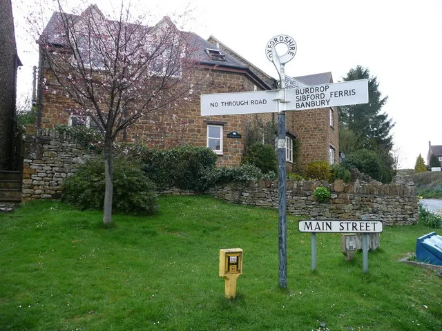 Signs at a crossroads on Main Street, Sibford Gower, Oxfordshire