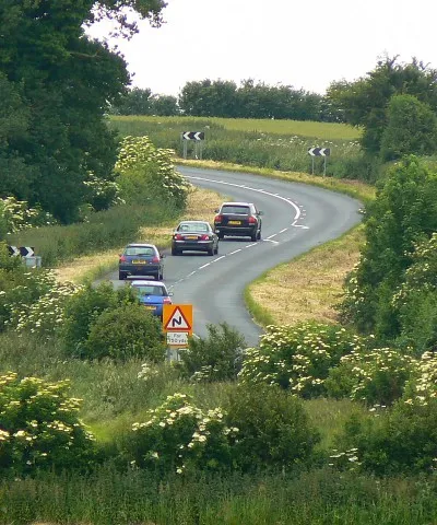 A4361 near Uffcott, Wiltshire A long shot across the square. The arrows indicating the start of a 'no overtaking' section are 90 metres from the western gridline and 168 metres from the southern gridline.