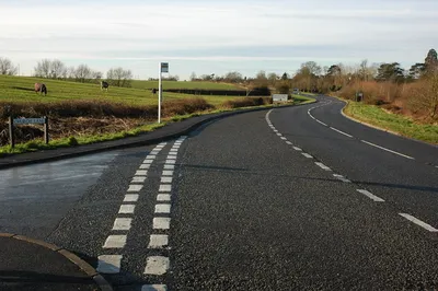 A38 at Prior's Norton View southwards of the A38 from the junction of Church Lane. The right turning right in the middle distance is to Bishop's Norton and Wainlode Hill.