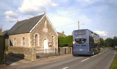 The village hall in Curbridge, West Oxfordshire, with a Stagecoach Gold bus outside on route S1. The hall was built in 1902 as a Methodist chapel. In 1978 it ceased to be used for worship and became the village hall.