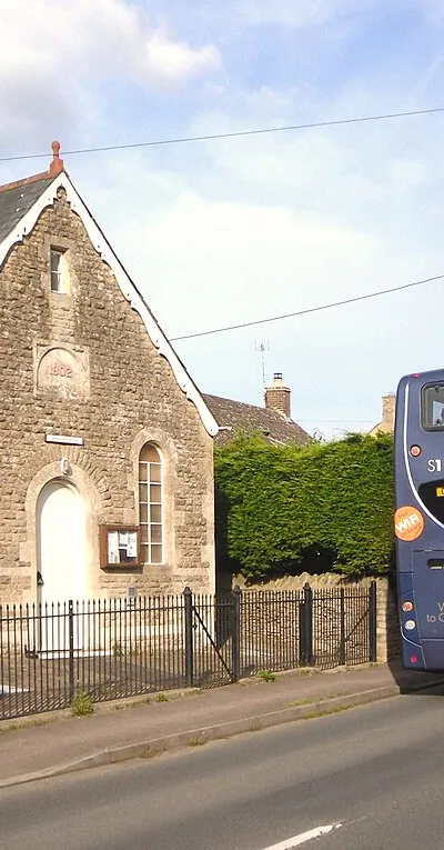 The village hall in Curbridge, West Oxfordshire, with a Stagecoach Gold bus outside on route S1. The hall was built in 1902 as a Methodist chapel. In 1978 it ceased to be used for worship and became the village hall.