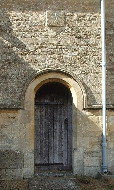 A door and a sundial