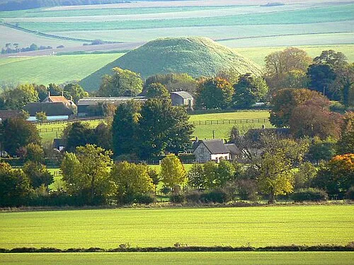 Avebury Trusloe, Avebury Avebury Trusloe is a small settlement west of its more famous neighbour. The conical hill in the background is Silbury Hill, said by some to be the remains of a load of old shoes dumped there by an itinerant cobbler on his way to (or perhaps from, I can't remember) Marlborough. This explanation is as likely as any other I've heard for the hill's existence.