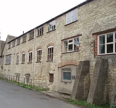 Frogmarsh Mill. The mill was already in use by 1658 and continued producing cloth until mid 1800s.  In the late 19th and early 20th century it was used for the manufacture of pins. Today it is occupied by a soft-drinks manufacturer and a variety of small businesses and studios. The buildings date from the 19th Century, and incorporate a much earlier clothier's house dating from the 17th century . The Woodchester area  was ideal for cloth manufacture because of deep valleys and rapid streams in this part of the Cotswolds.