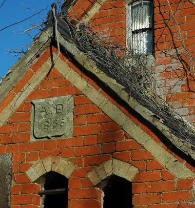 Chapel gable end, Stoke Orchard The gable end of this former chapel dates it to 1865.