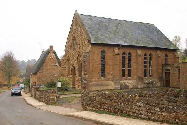Methodist chapel, Hornton, Oxfordshire: built as a Primitive Methodist chapel in 1884. On the left, Miller's Lane descends past thatched cottages to the green.