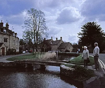 Bridge over River Eye, Lower Slaughter, Gloucestershire Looking east over one of the small stone bridges over the River Eye, with cottages on the left and in the distance.