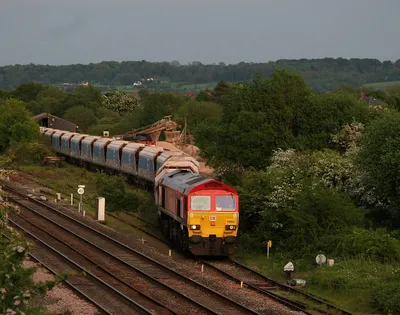 7C66 TX-Q 19:41 Wootton Bassett-Merehead MendipRail 59 empty bogie hoppers prepares to leave Wooton Bassett with 59 204 in charge.