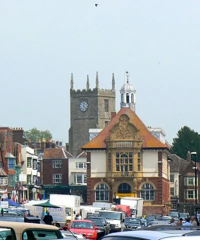A view along Marlborough High Street Looking north-east. The Town Hall is just to the right of centre with the tower of St Mary's church behind it. Market day (Saturday).