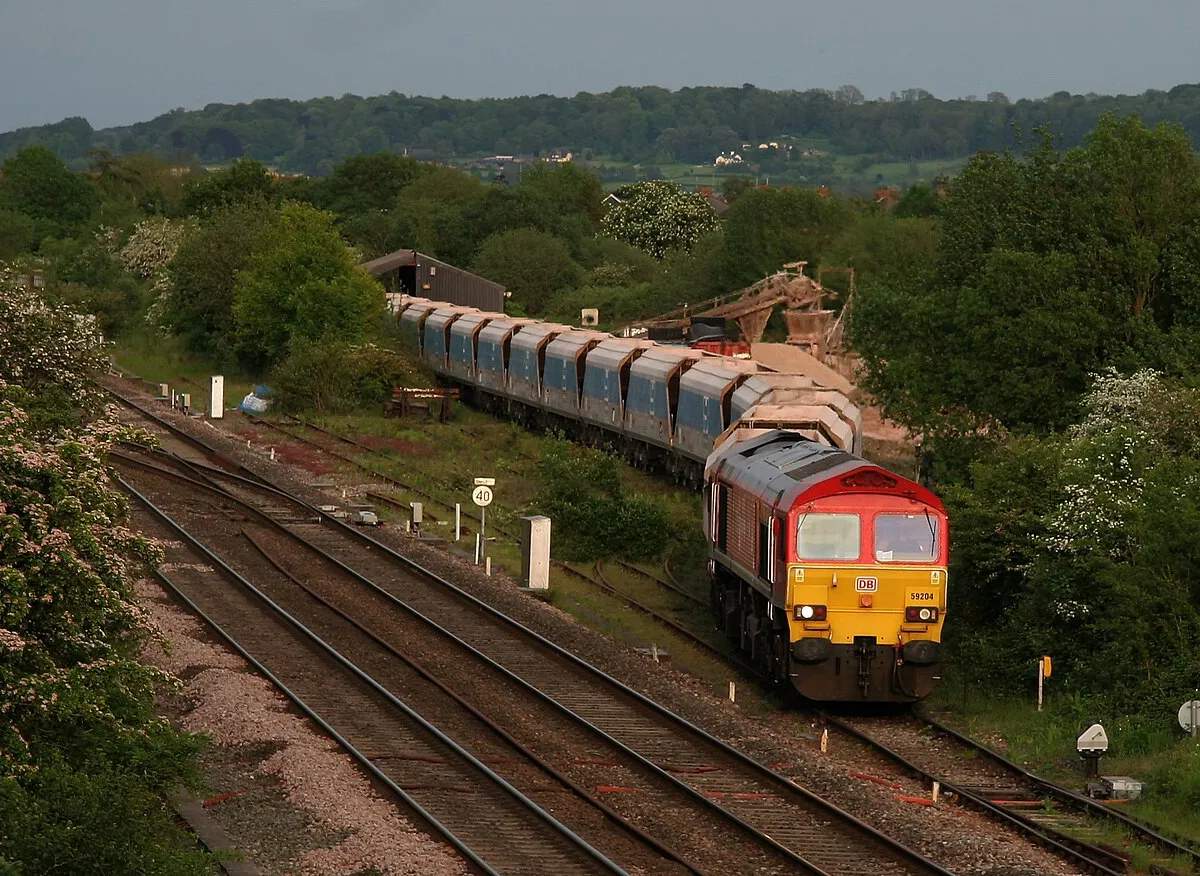 7C66  TX-Q 19:41 Wootton Bassett-Merehead       MendipRail 59  empty bogie hoppers prepares to leave Wooton Bassett with 59 204 in charge.