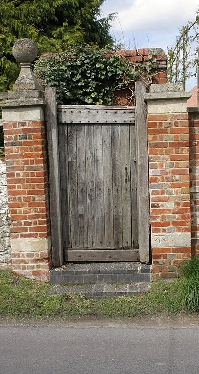 Benchmark on gatepost, South Street