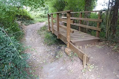 A footbridge and dried up stream