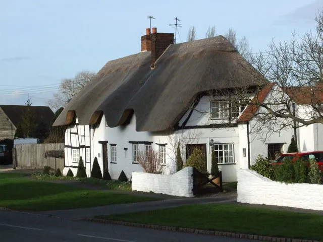 Thatched cottages opposite St Swithin's parish church, Lower Quinton, Warwickshire