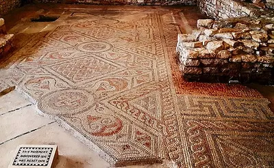 North Leigh Roman Villa Mosaic detail. The villa is near Fawler, whose Old English name, fāg flōr, means "variegated floor"; authorities including J. R. R. Tolkien have taken this to mean that the village was named for the presence of the mosaic floor.