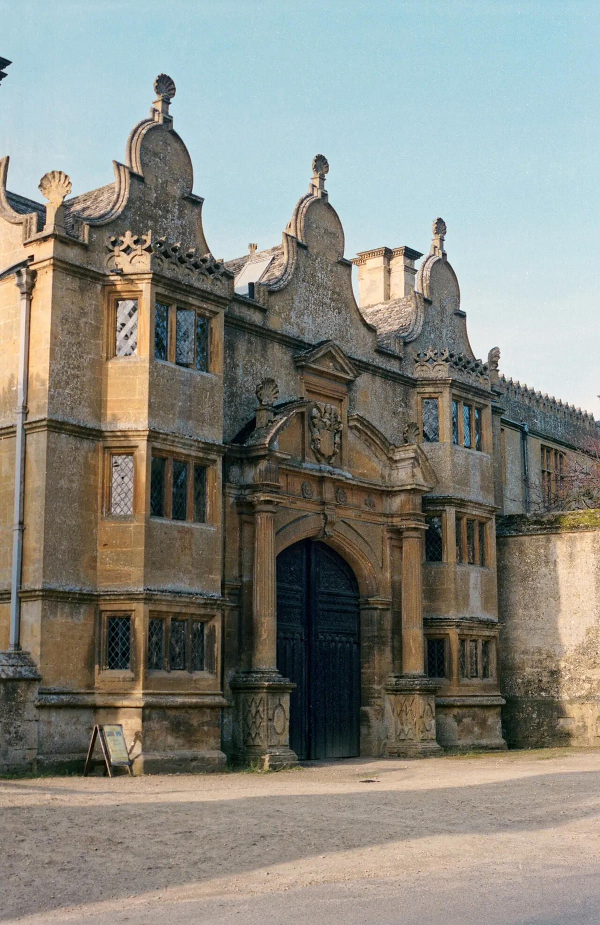 1992 Spring photograph of the entrance to Stanway House at its south-west, on Cotswold Way in Stanway, Gloucestershire, England.Processing: SLR camera Kodak Gold ASA 200-2 film negative scanned with an Epson Perfection V800 using SilverFast 8 scan program, and optimized, cropped and spun with DxO OpticsPro 10 Elite and Adobe Photoshop CS2.