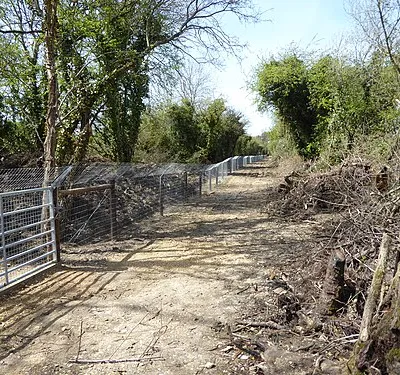 Bridleway near fenced-off lake