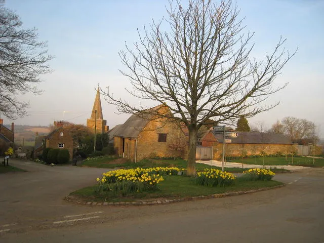Shotteswell, Warwickshire, with daffodils in the foreground and the steeple of St Laurence's parish church in the background