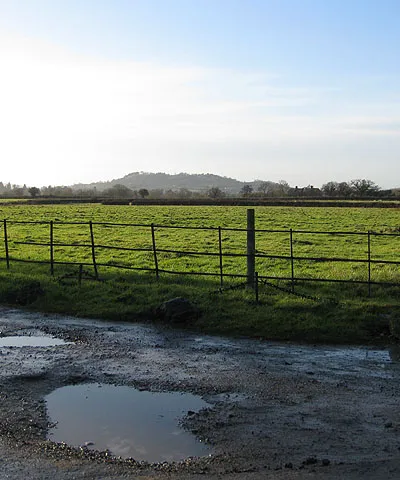 Across a pasture towards Churchdown Hill Near the entrance to a property marked on the map as South Park.