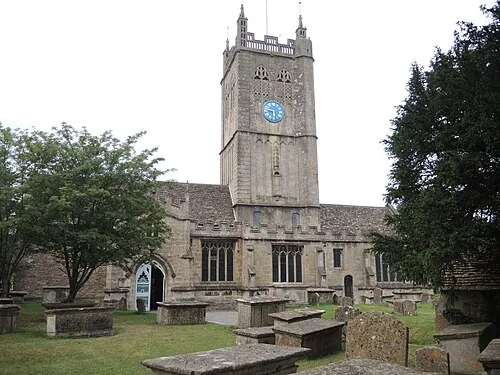 A big tower on a small church