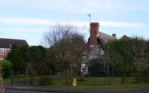 Ancient cottage beside the houses of Norton development