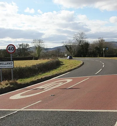 Entrance to Welland On the bend of the A4104 road from Upton just before the Anchor pub.
The sign is in the parish of Upton.
The Welland parish boundary is at the next road junction.