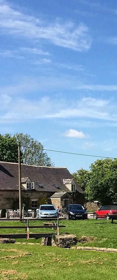 The King's Head inn standing on the green, Bledington