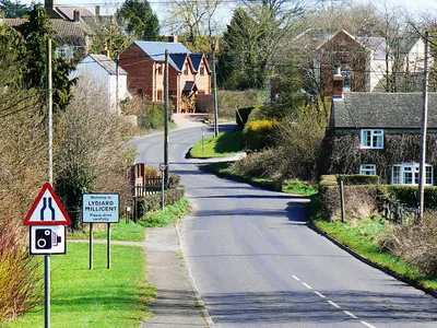 Lydiard Millicent. The viewpoint is the same as used in this one 1204424 The difference is that some zoom has been applied. Lydiard Millicent is a dormitory village for the town of Swindon a few kilometres south-east of here.