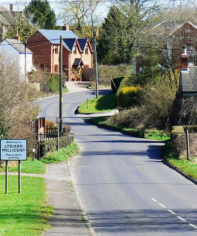 Lydiard Millicent. The viewpoint is the same as used in this one 1204424 The difference is that some zoom has been applied. Lydiard Millicent is a dormitory village for the town of Swindon a few kilometres south-east of here.