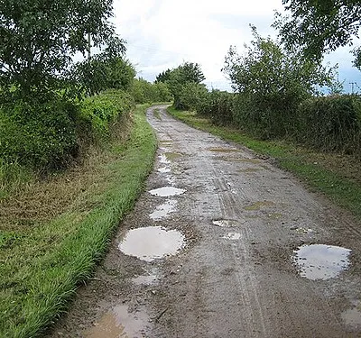Bovone Lane, Tibberton Muddy lane leading to a farm.