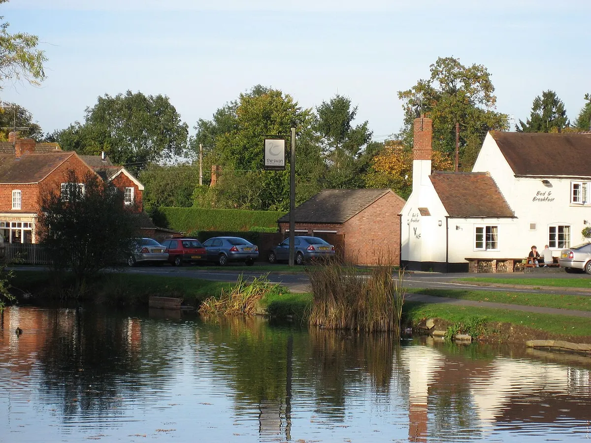 Pond and pub at the village of Hanley Swan, Worcestershire, England