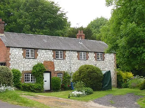 "White Cottages", Bishopstone Cottages built of chalk blocks with brick edging. They face on to Bishopstone's village pond.