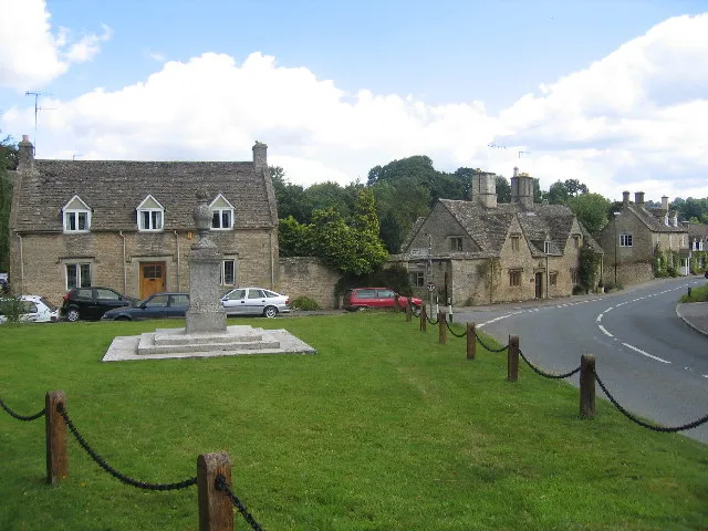 Lower Swell. Entering the village from the west with the well cared for war memorial and the main street.
