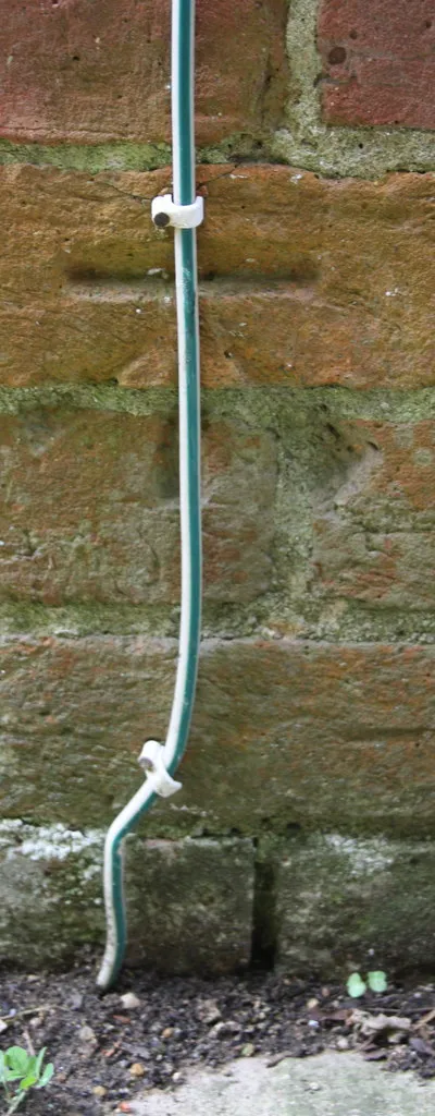 Benchmark on #105 Wootton Village Boars Hill