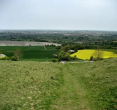 Bridleway on the slopes of Morgan's Hill This looks north as it descends beside an ancient earthwork to the right.  The path is part of the White Horse Trail, just before it unites with the Wessex Ridgeway at the gate to turn right.