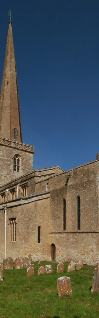 Parish church of SS Peter and Paul, Church Hanborough, Oxfordshire, seen from the southeast. The church is 12th century but was remodelled in about 1399, which may be when the spire was added.