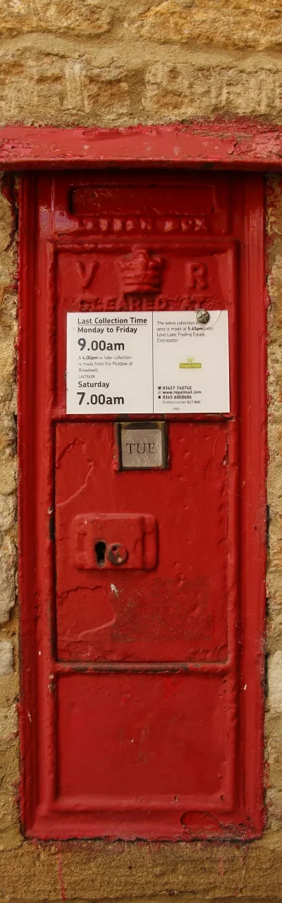 VR postbox mounted in the wall of Dossett's Old School, Kencot, Oxfordshire