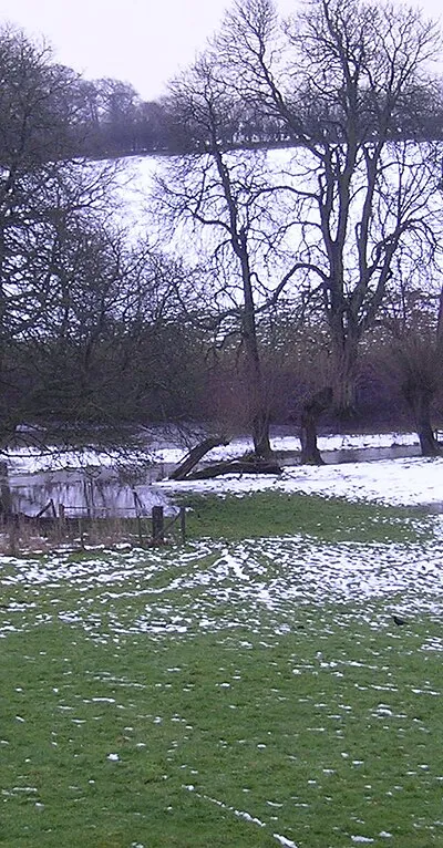 After the Snow : Flood Water overflows the banks of the River Glyme after the rapid thaw of snow.
