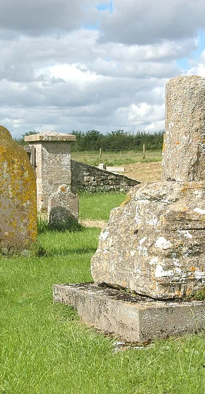 Base and broken shaft of 15th-century stone cross in the chapel yard of St Mary, Shifford, Oxfordshire