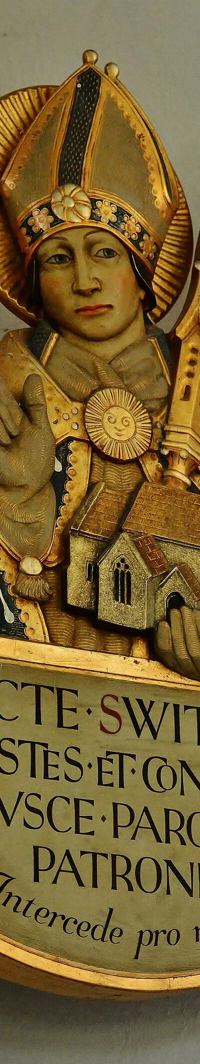 Compton Beauchamp: St. Swithun's Church: St. Swithun holding the church by Martin Travers