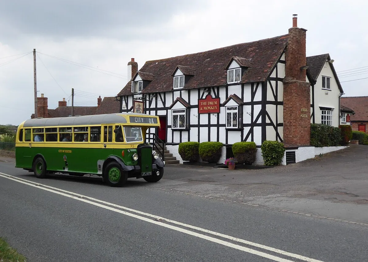 A vintage bus arriving at the Drum and Monkey