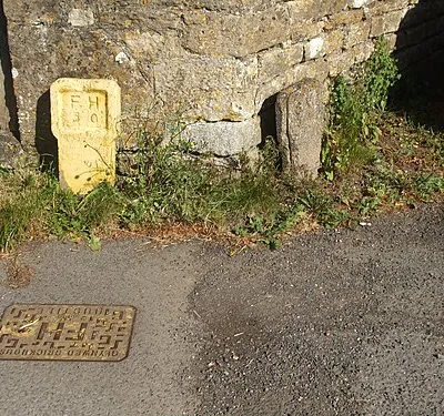 A hydrant marker set in stone