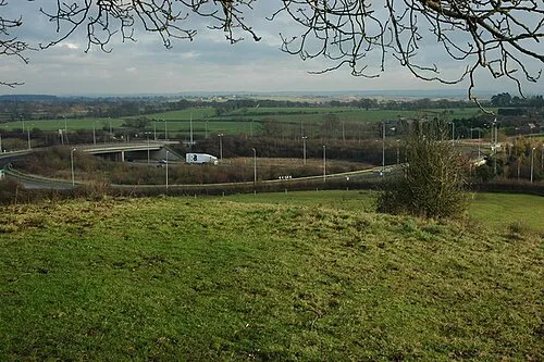 M5 Junction 7 The M5 motorway junction 7 viewed from Whittington Tump or Crookbarrow Hill. This junction was rebuilt in the early 1990s when the motorway was widened to three lanes, the junction now has two bridges and a roundabout before the widening there was a single bridge.