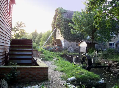 Little Clanfield Mill, Little Clanfield, Oxfordshire. The old mill has been turned into a house but there is still a mill in use using the water wheel in the left foreground.
