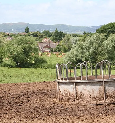 Cattle feeder, Sudeley Farm Located on the top of a small ridge, the farm has a commanding view over the land to the east and the west. To the west are the Malvern Hills. The quarried face of Black Hill is on the left and the highest peak, Worcestershire Beacon, is on the right.