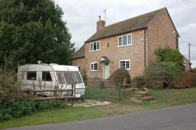 After the flood, Tirley A caravan in front of houses is a common sight in many villages and towns in the Severn valley after the flood of July 2007. This cottage is opposite the church which was also a victim. The flood reached halfway up the ground floor windows of this cottage.