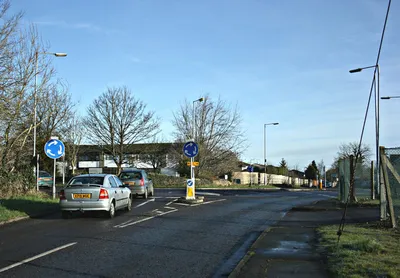 Fiveways Roundabout, Hawthorn Fiveways is a twin mini-roundabout which needs care to negotiate especially at busy times.
The five ways are:
1. Bradford Road, the B3109 coming from Bradford on Avon behind the camera.
2. Continuation of Bradford Road almost straight ahead going to Rudloe and Corsham.
3. The minor road to the right for Westwells, Moor Green and Neston.
4 & 5. Boxfields Road and Leafy Lane, two minor roads exit left.