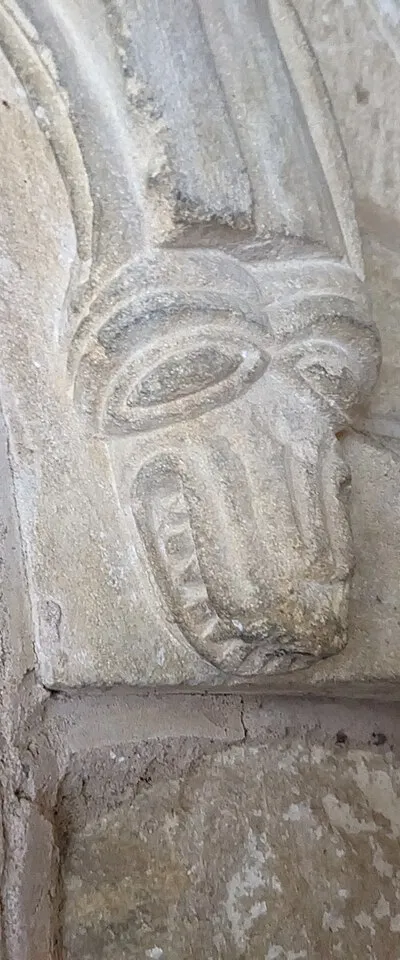 Carved head inside St. Nicholas church (Teddington)